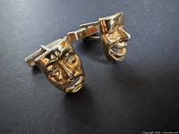 Front view showing comedy and tragedy mask faces