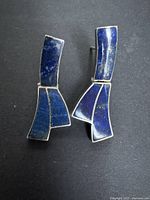 Front view of both earrings showing blue stone inlays