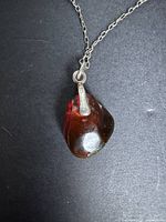 close-up of amber pendant and 925 bail on chain