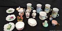 Entire assortment of mugs, miniature vases, dishes and bowls displayed