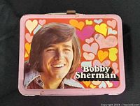 Front view of lunch box showing Bobby Sherman portrait and heart graphics