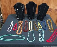 Full lot overview showing all necklaces and bracelet