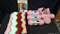 All items overview including One Pound skeins, partial ball, ripple afghan and pattern book