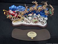 Front view of complete Redskins Santa's Big Night figurine and separate base panel