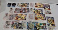 Overview of all sealed Spy Kids Happy Meal toys laid out on white surface
