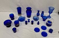 Group view of assorted cobalt blue glass pieces