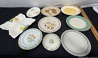 Group view of assorted platters, plates and leaf dish
