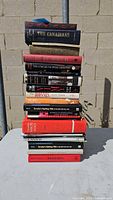 Full stack of Canadian books on table