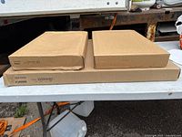 Three IKEA boxes on table showing overall lot