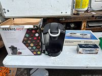 Front view of all three boxed items and Keurig unit