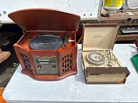 Both record players side by side on table