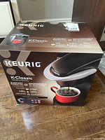 Sealed Keurig K-Classic coffee maker box front showing product image