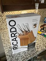 Front of sealed retail box showing Ricardo rotating block set contents