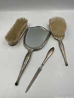 Overview of all four sterling silver vanity pieces