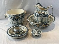 Group shot of all seven Stratford Art Nouveau pottery pieces