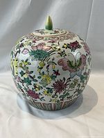 Front view of Famille Rose porcelain ginger jar with lid