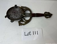 Full view of bronze dagger-form ashtray