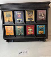 Front view showing all eight labeled drawers and knobs