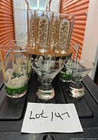 All ten glasses grouped: floral, swan, Grey Goose