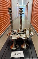 All six candlesticks grouped on mirror tray