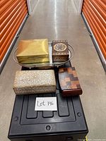 All four boxes grouped: brass, painted floral, whitewash carving, parquet