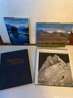 Front view of four hardcover nature photography books