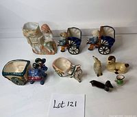 Full lot overview showing all nine ceramic pieces