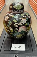 Front view of ginger jar showing floral and bird decoration