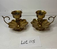 Pair of brass flower candle holders front view