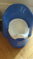 Front view blue Baby Björn potty chair