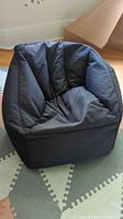 Front view of black bean bag chair