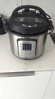 Front view of Instant Pot Duo SV with lid attached
