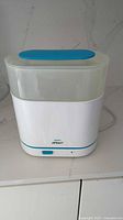 Front view of Philips Avent sterilizer showing body, lid and chamber