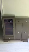 Full view of painted solid wood sideboard with glass display section