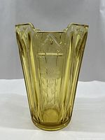 Front view of amber glass vase showing cornflower etching and art-deco shape