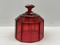 Front view of cranberry glass cloche showing overall shape and color