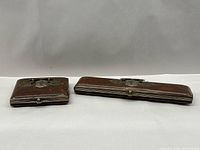 Both leather cases side by side showing size difference