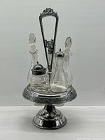 Full view of cruet set on pedestal stand
