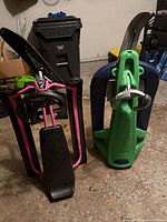 Front view of both snow racers upright showing frames, skis and steering components