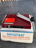 Full view of maroon Premier Supermatic machine on original box