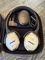 Headphones, case, cable, charger, airline adapter