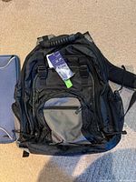 Front view of black Targus backpack with hangtags attached