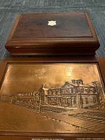 Copper plaque and wooden silverware box together