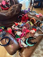 All headbands spread on chair and bag in background