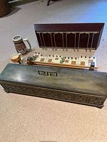 Group shot showing potpourri box, wine glass shelf, desert rack, two steins