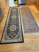 Both runner rugs side by side on hardwood floor