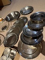 Overview showing baskets, bowls, plates, and boxed cups