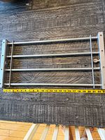 Top view showing entire bar retracted with tape measure indicating width