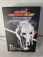 Front of sealed box showing General Grievous helmet building block toy, age 8+, item No.66005