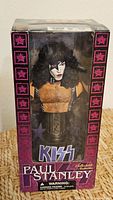 Front of boxed Paul Stanley statuette showing figure and KISS logo